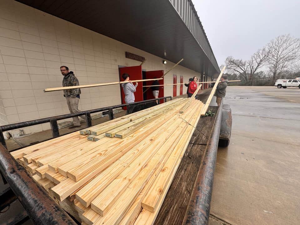 Lumber stacked on a trailer, ready for a project