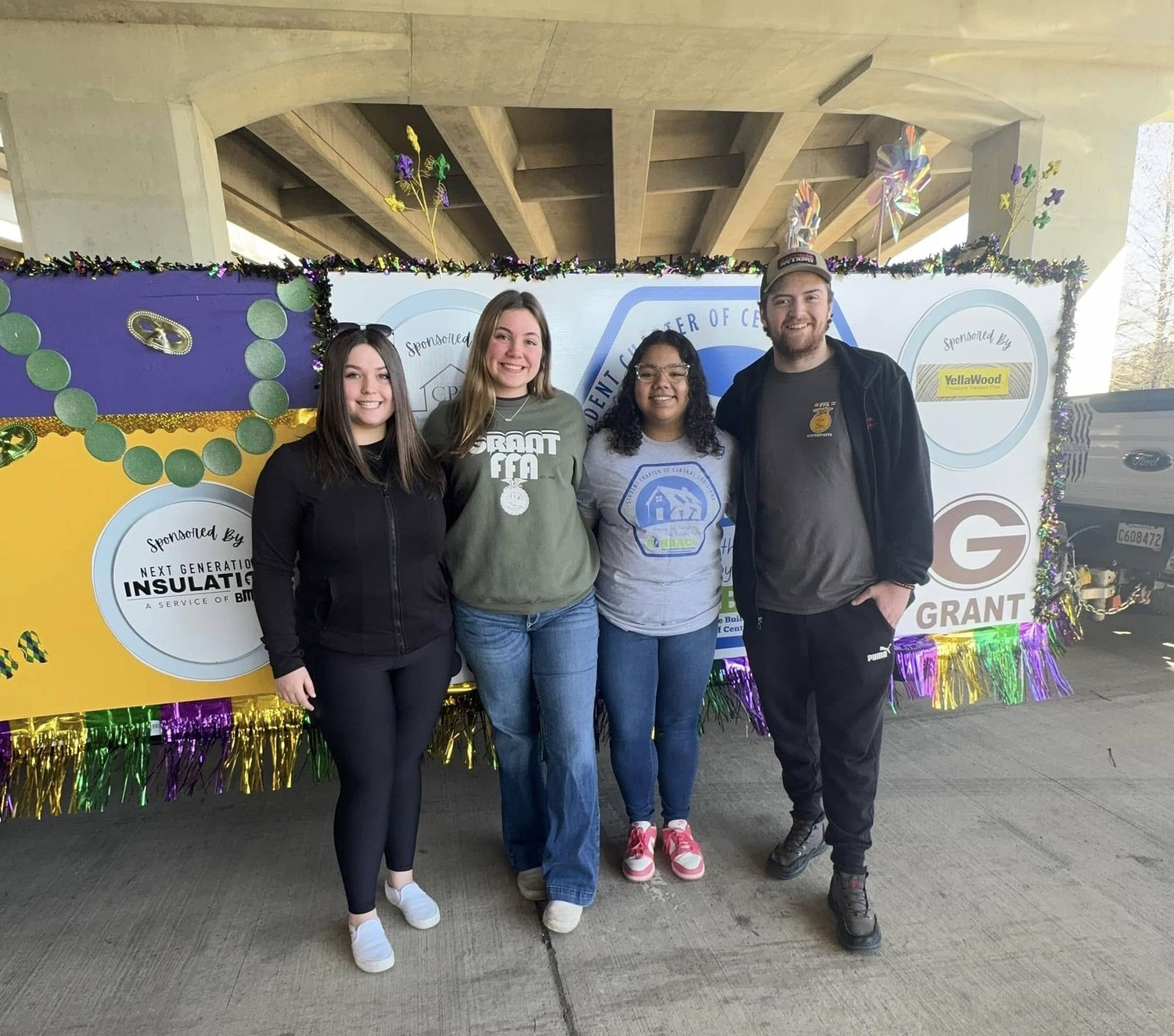 Students and volunteers at the Mardi Gras float